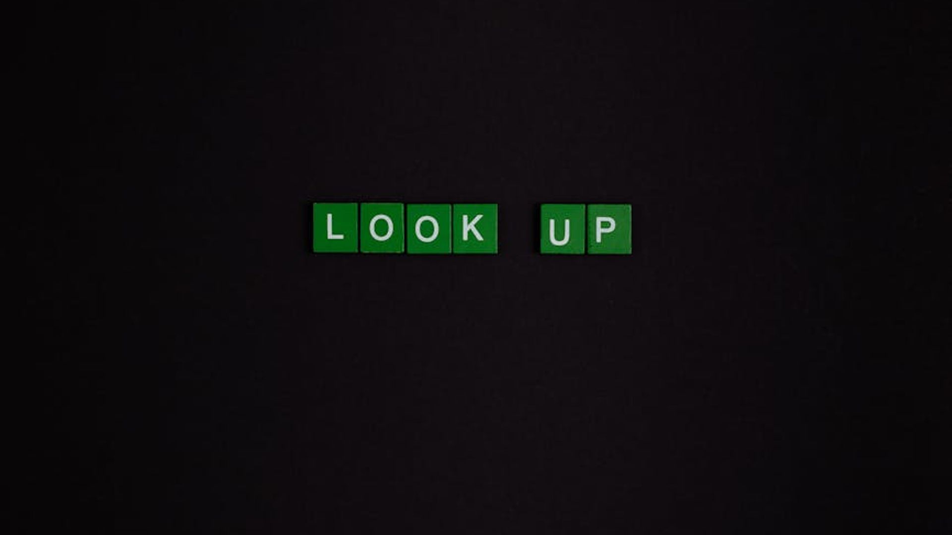 Minimalistic dark training space with a subtle lime green light source.